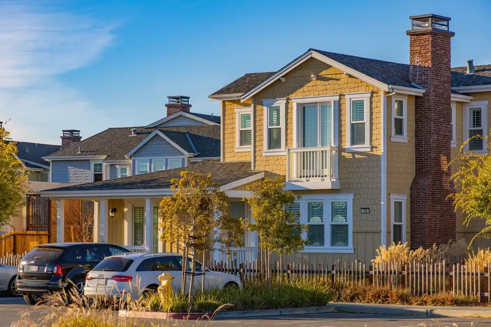 Craftsman style homes with pitched asphalt shingle roofs